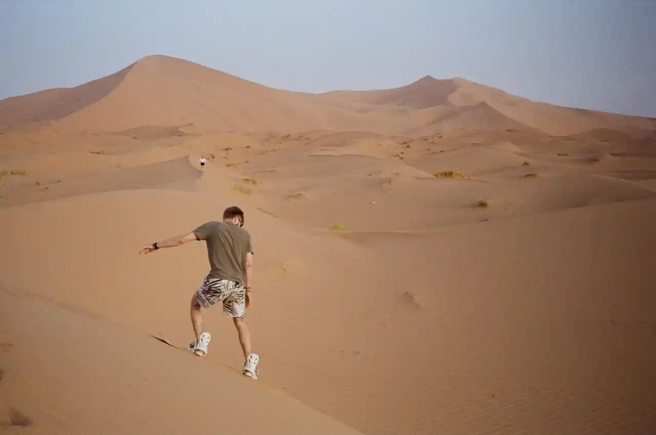 Sandboarding on the Erg Chebbi dunes near Merzouga