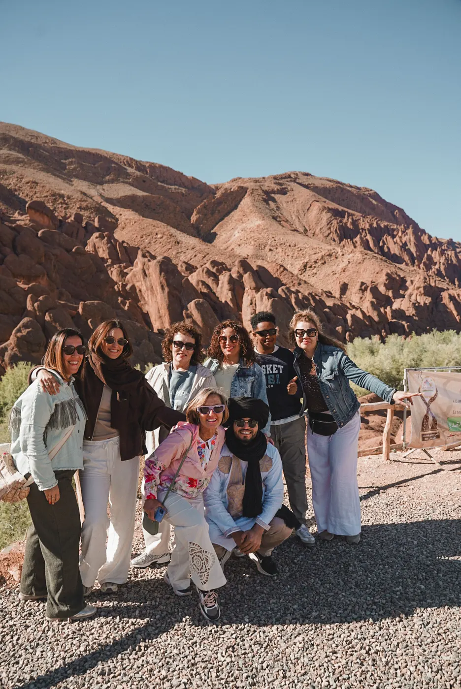 Travelers beside the rock formations of the Dades Valley