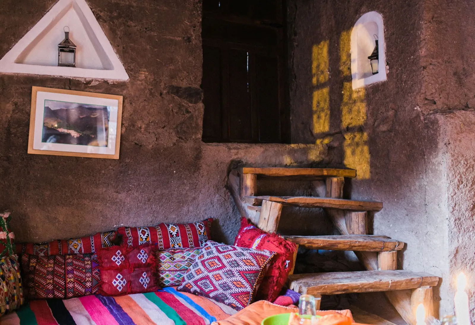 Colorful cushions and rugs inside a traditional house in Imlil