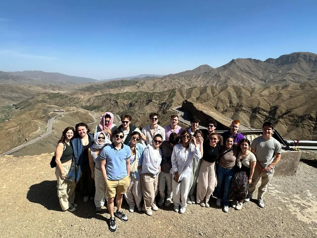 Travelers at a viewpoint above the Tizi n’Tichka pass in the High Atlas
