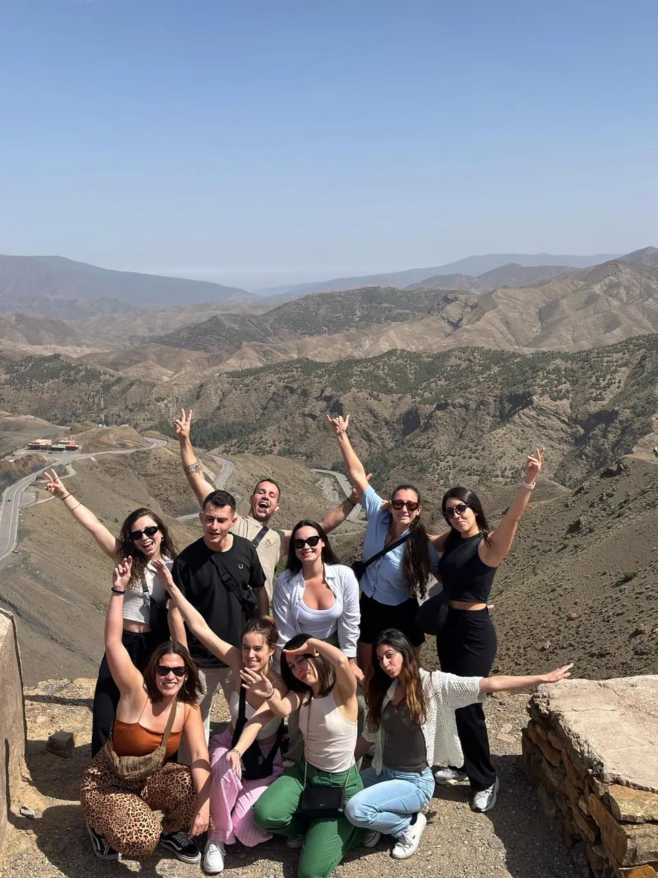 Travelers at a High Atlas mountain viewpoint